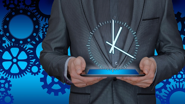 man  holding a clock with gears in the background